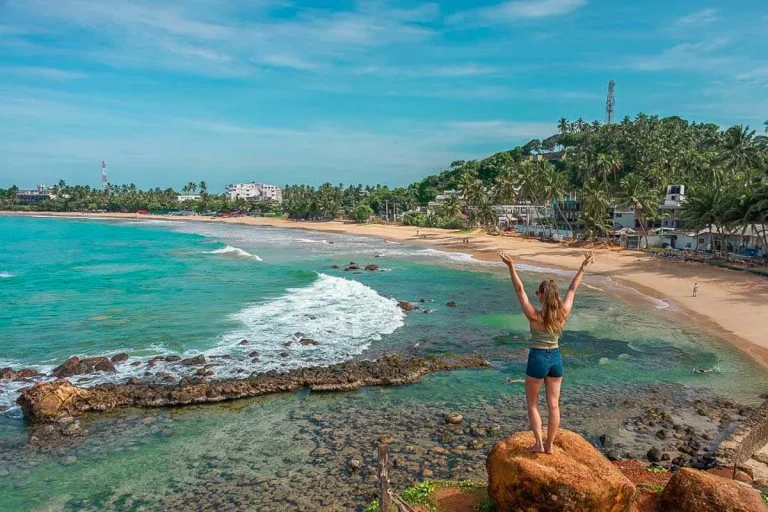 Rocky shore and beach near Parrot Rock at Mirissa, Sri Lanka