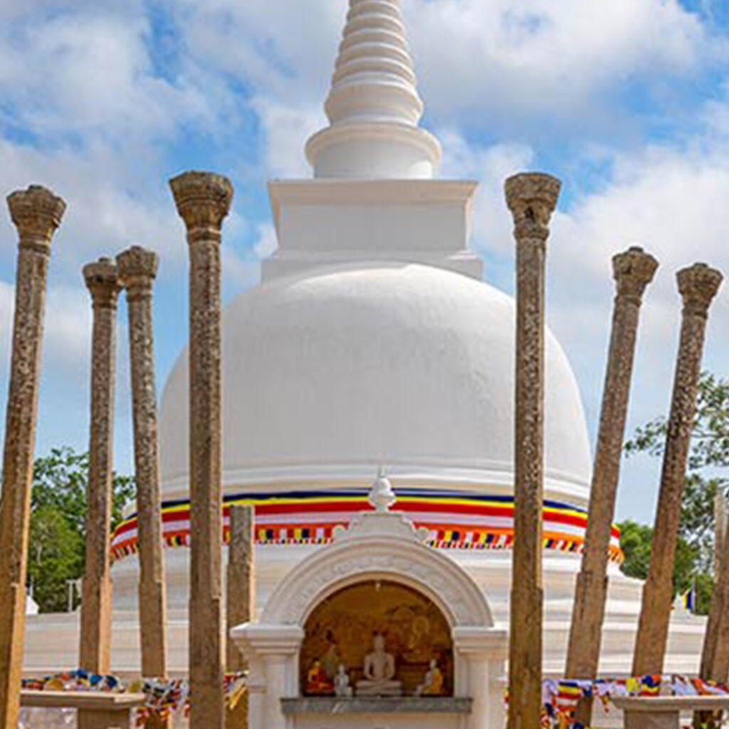 White stupa with stone pillars at Anuradhapura, Sri Lanka