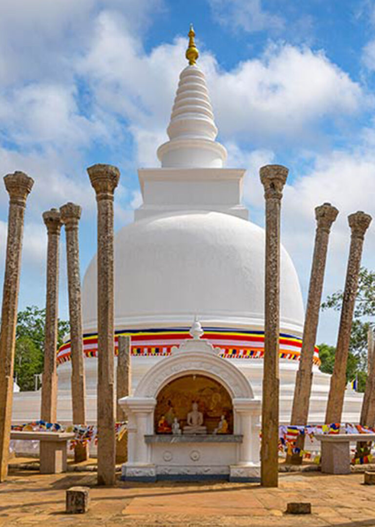 White stupa with stone pillars at Anuradhapura, Sri Lanka