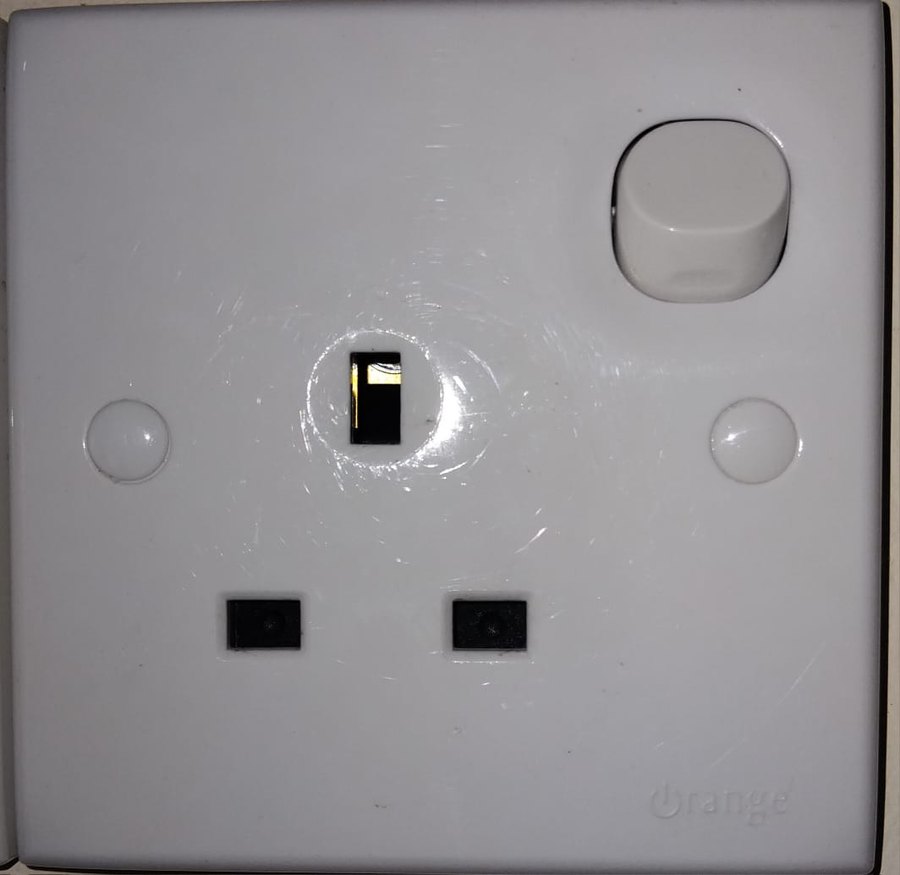 A Type G wall socket with three rectangular pin holes, the standard plug type in Sri Lanka